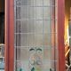 Late 19th century store doors, haberdashery front with Art Nouveau stained glass windows