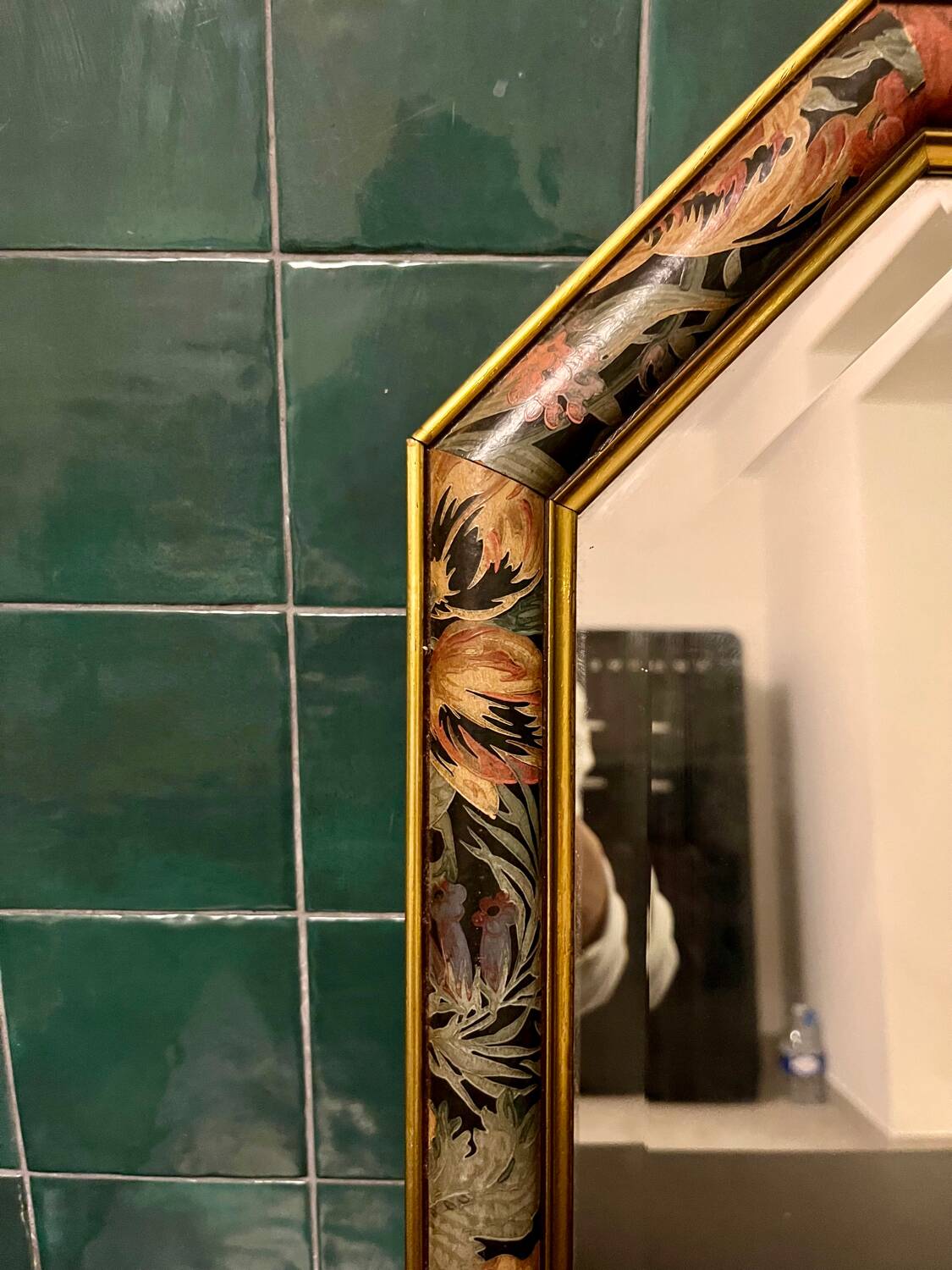 Vintage beveled mirror with floral frame