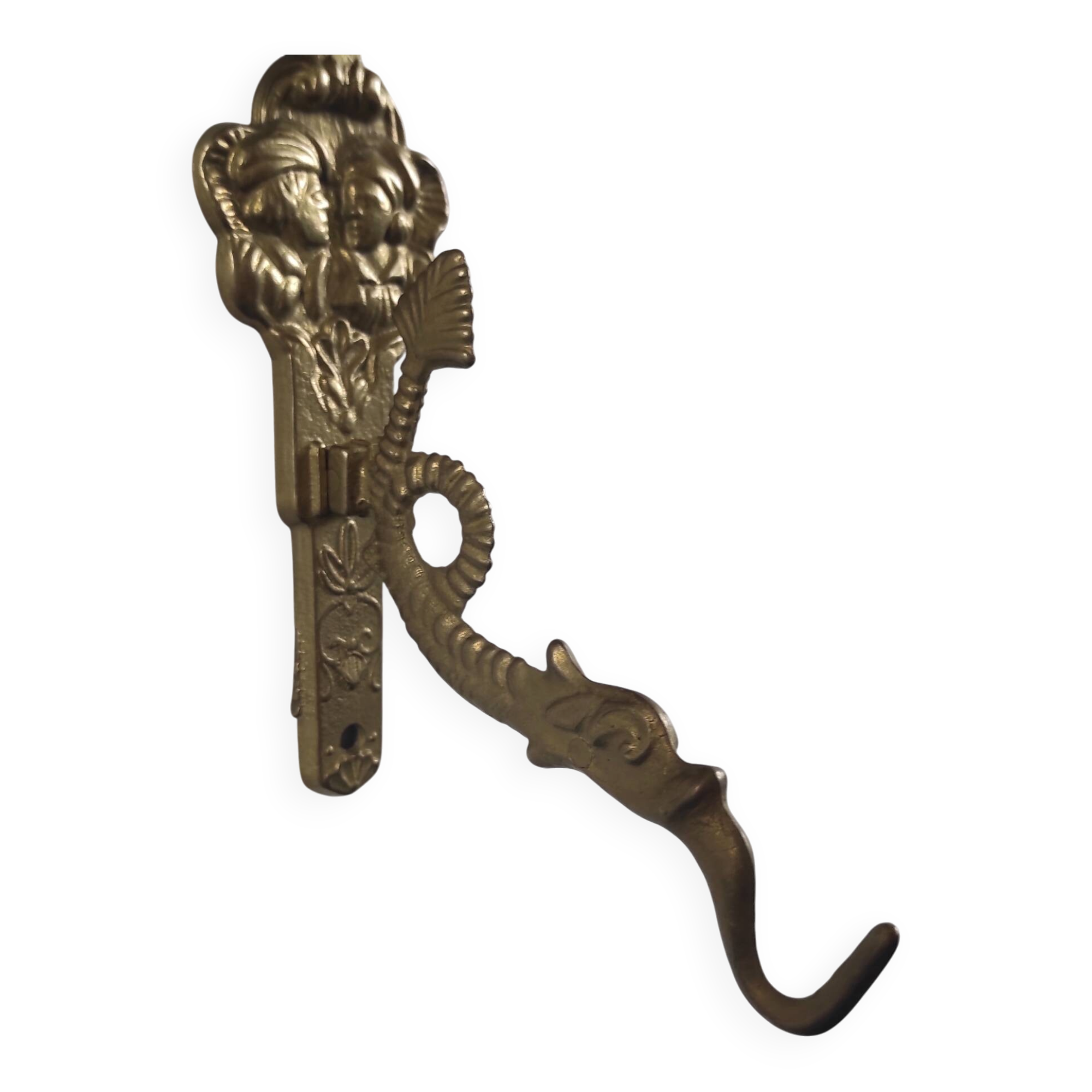 Vintage brass coat hook with marine creature motif and medallion.