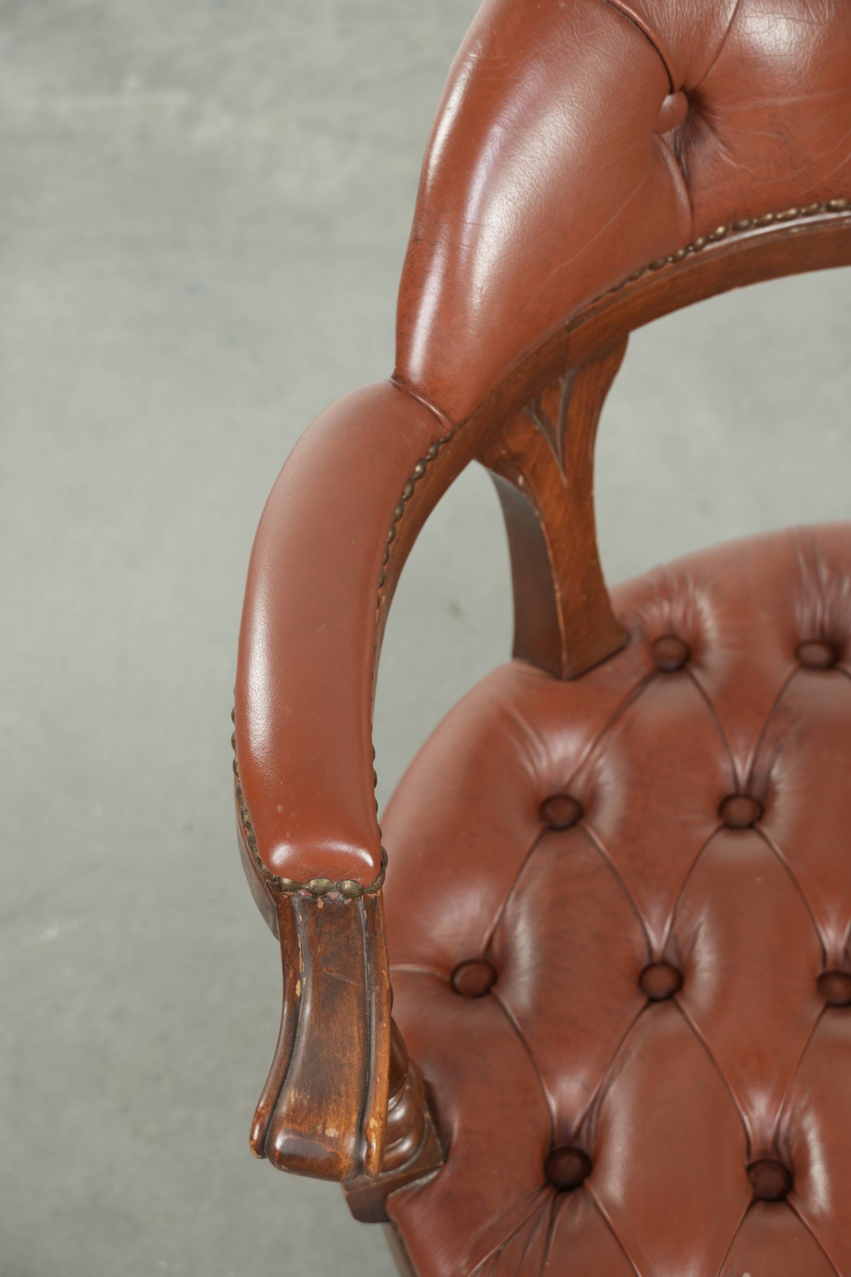 Swivel cowhide English style chesterfield office chair in a brown colour