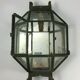 Metal and brass wall light with mirror background 1900