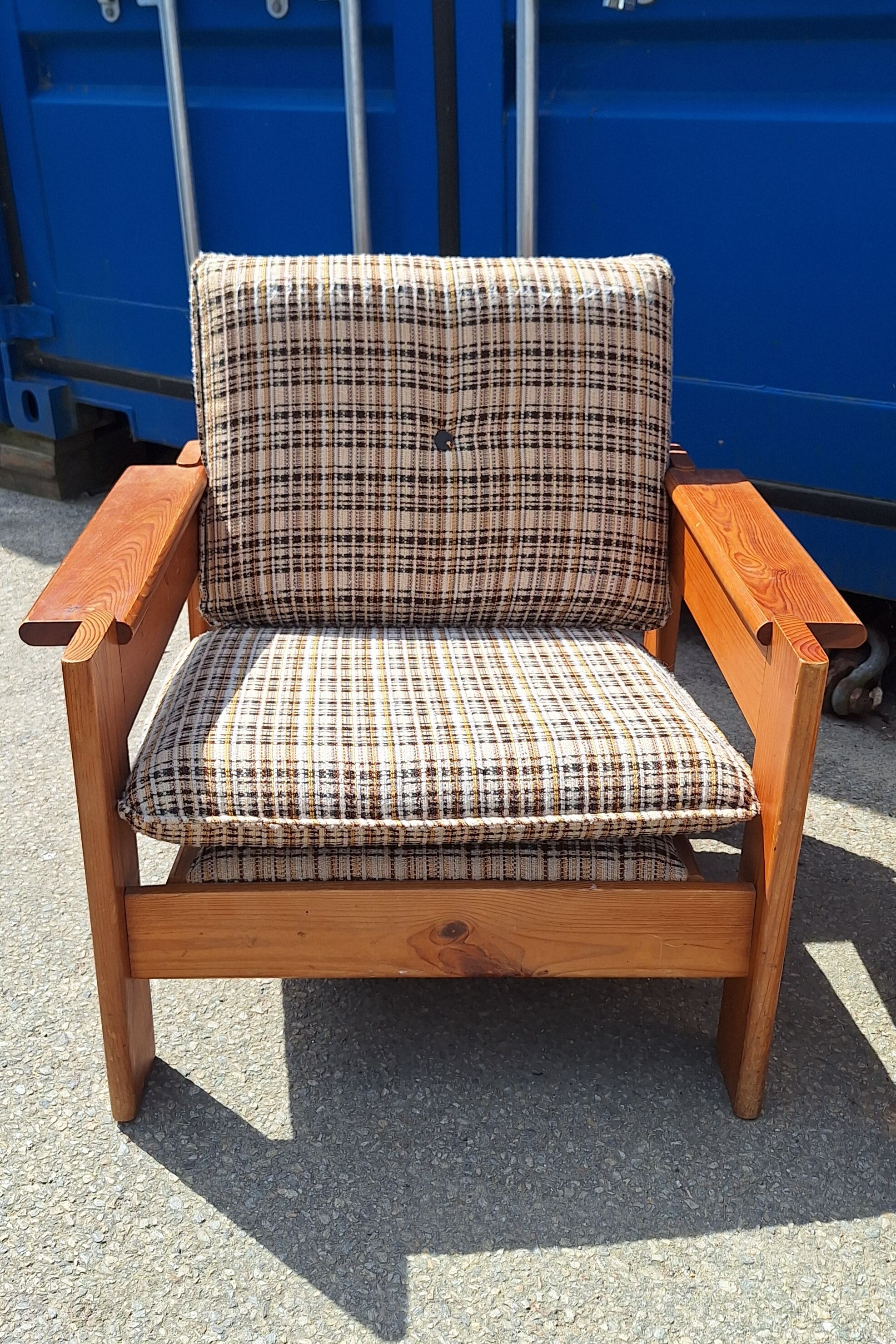 Brutalist-style bench and armchairs in 1970s pine.