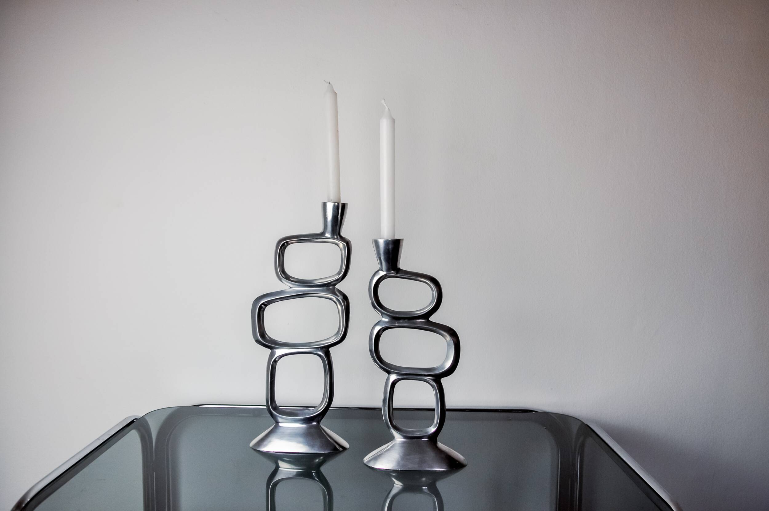 Pair of circle candlesticks by Matthew Hilton, England, 1980