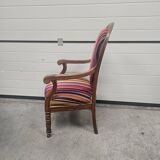 Antique armchair in multi-colored striped velvet with turned legs
