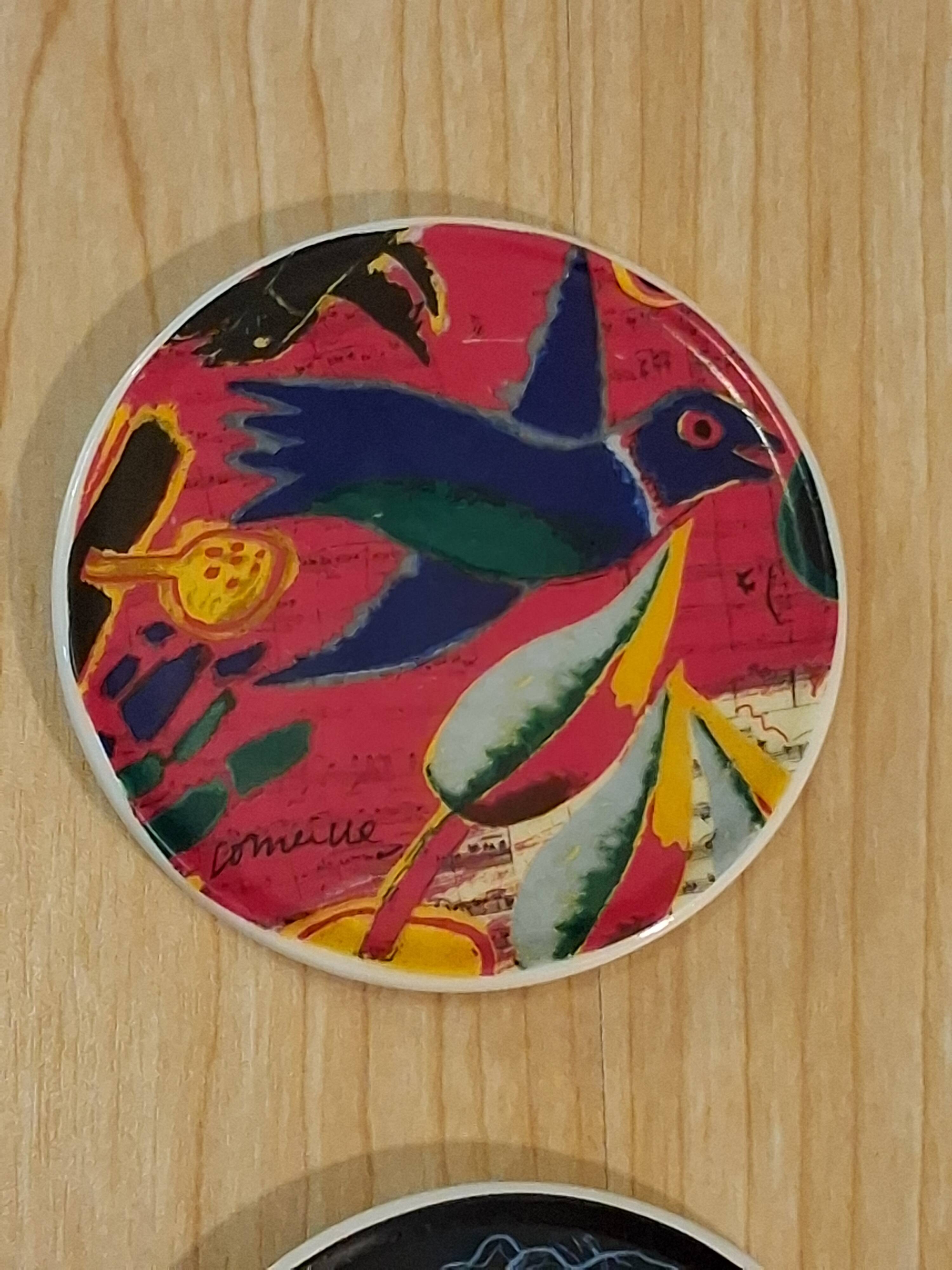 Coasters by the artist Guillaume Cornelis, known as Corneille, from 2001.