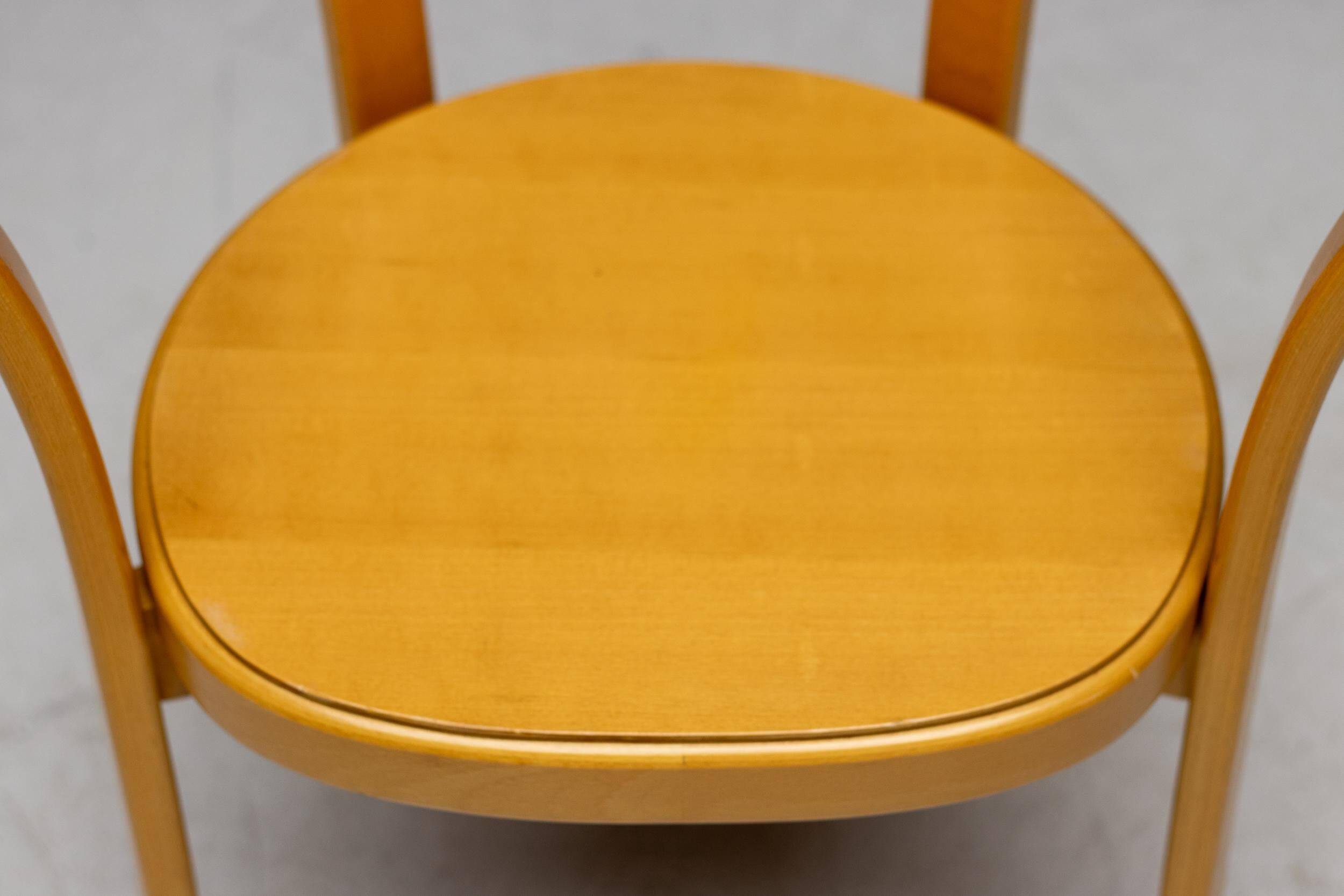 Stackable chairs in curved beech.