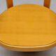 Stackable chairs in curved beech.