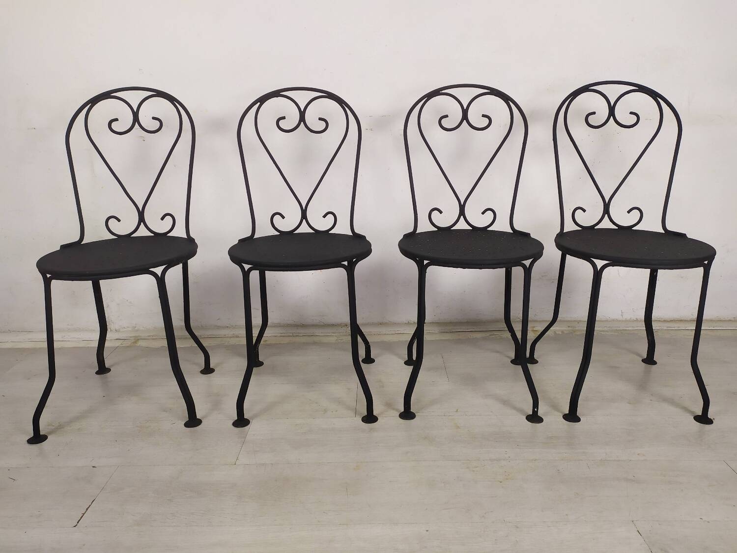 4 black garden chairs