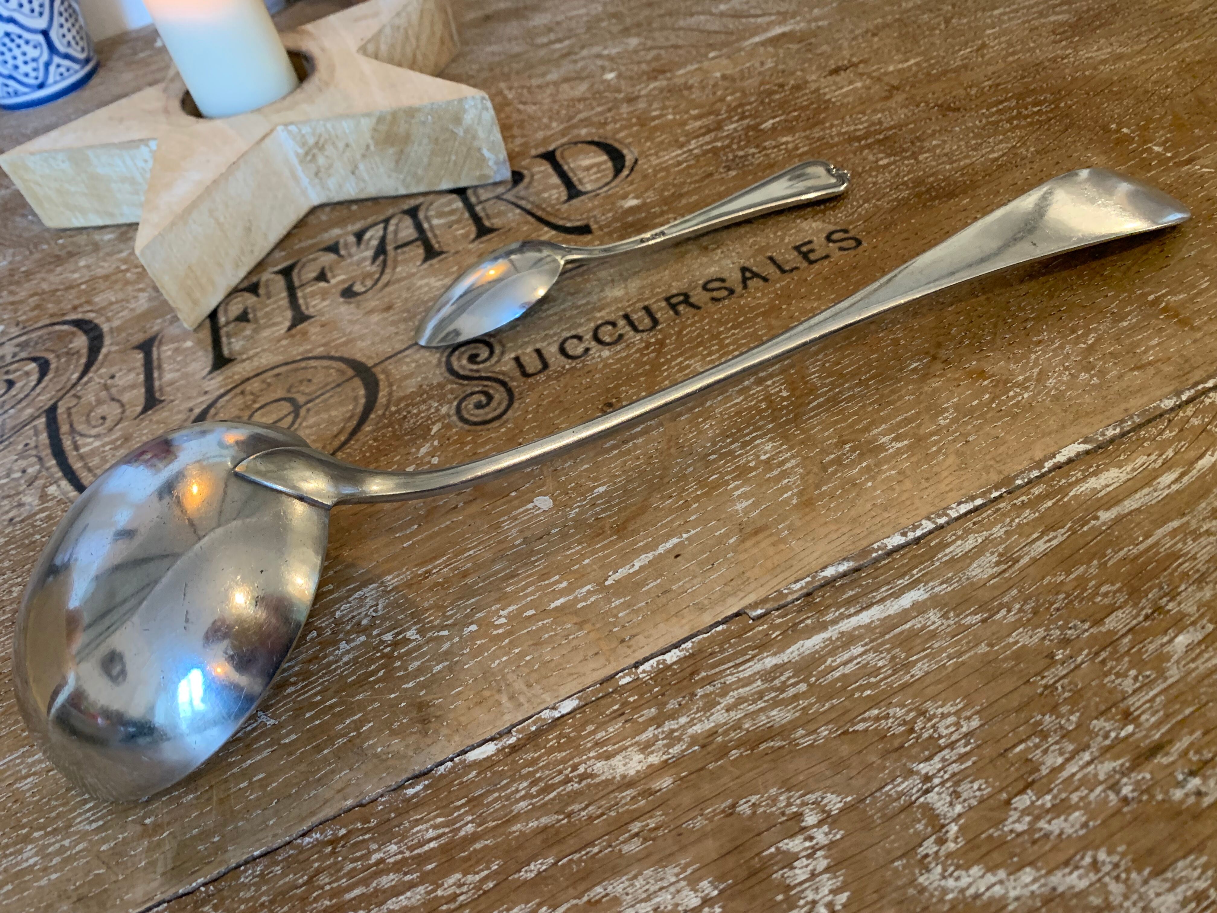1 ladle and 1 spoon in silver