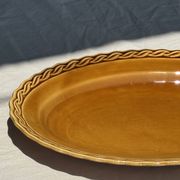 Antique oval dish, yellow-orange, frieze border L:24