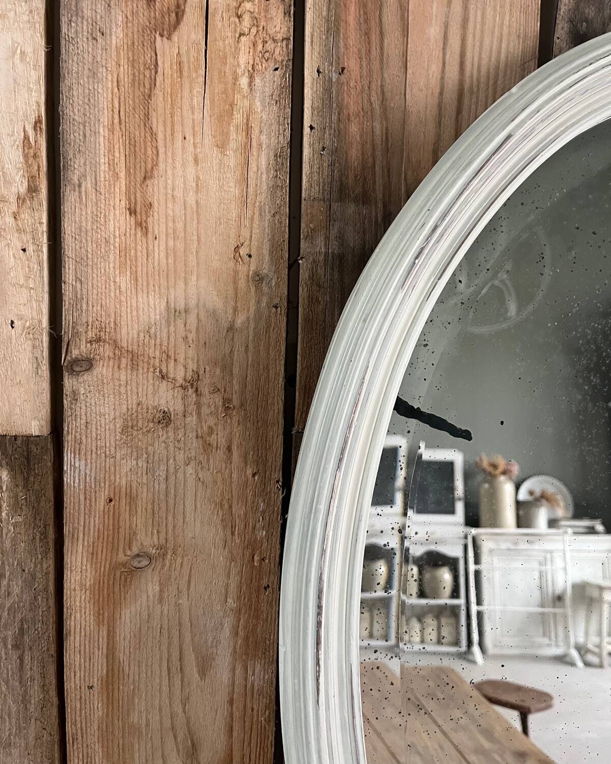White patinated oval mirror
