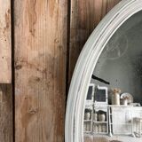 White patinated oval mirror