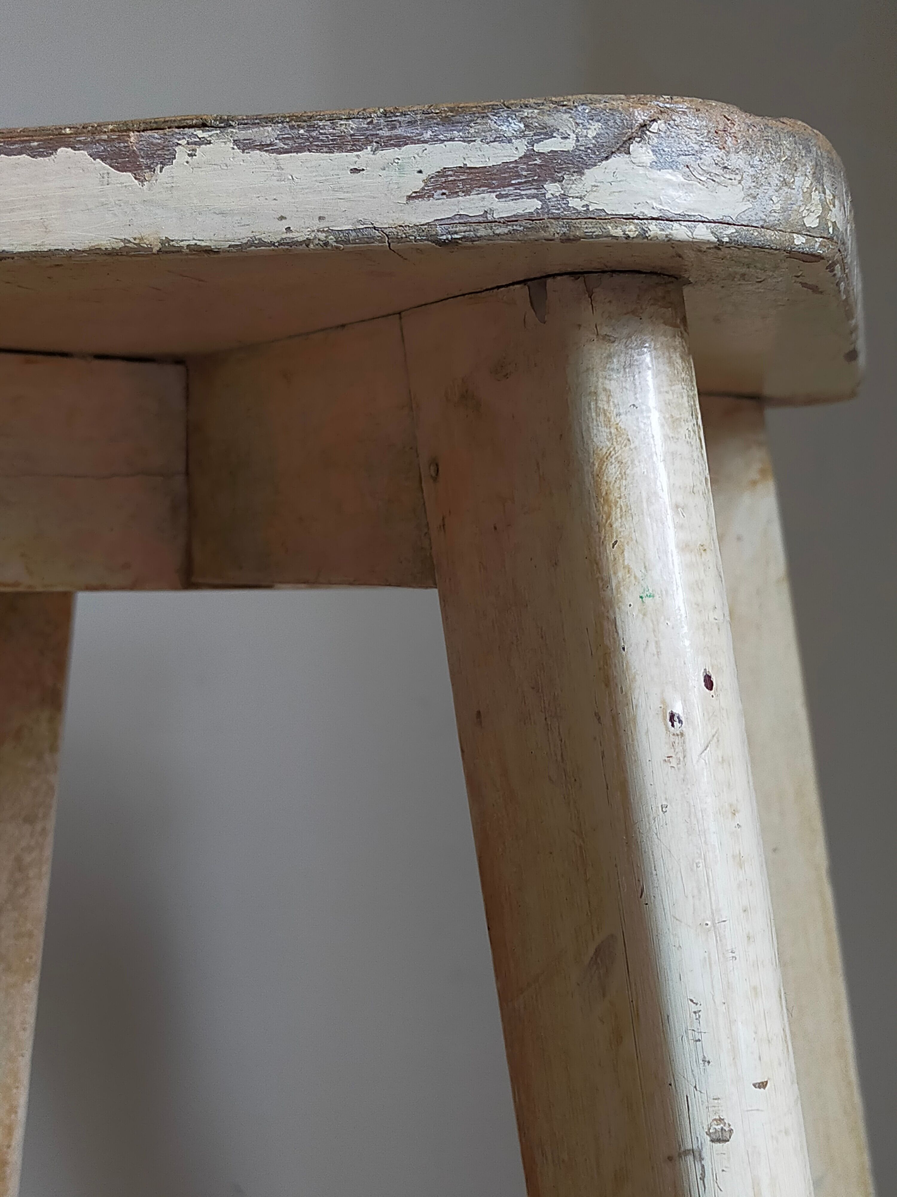 Old workshop stool in patinated solid wood