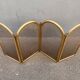 Antique brass fireplace screen from 1920, vintage spark guard.