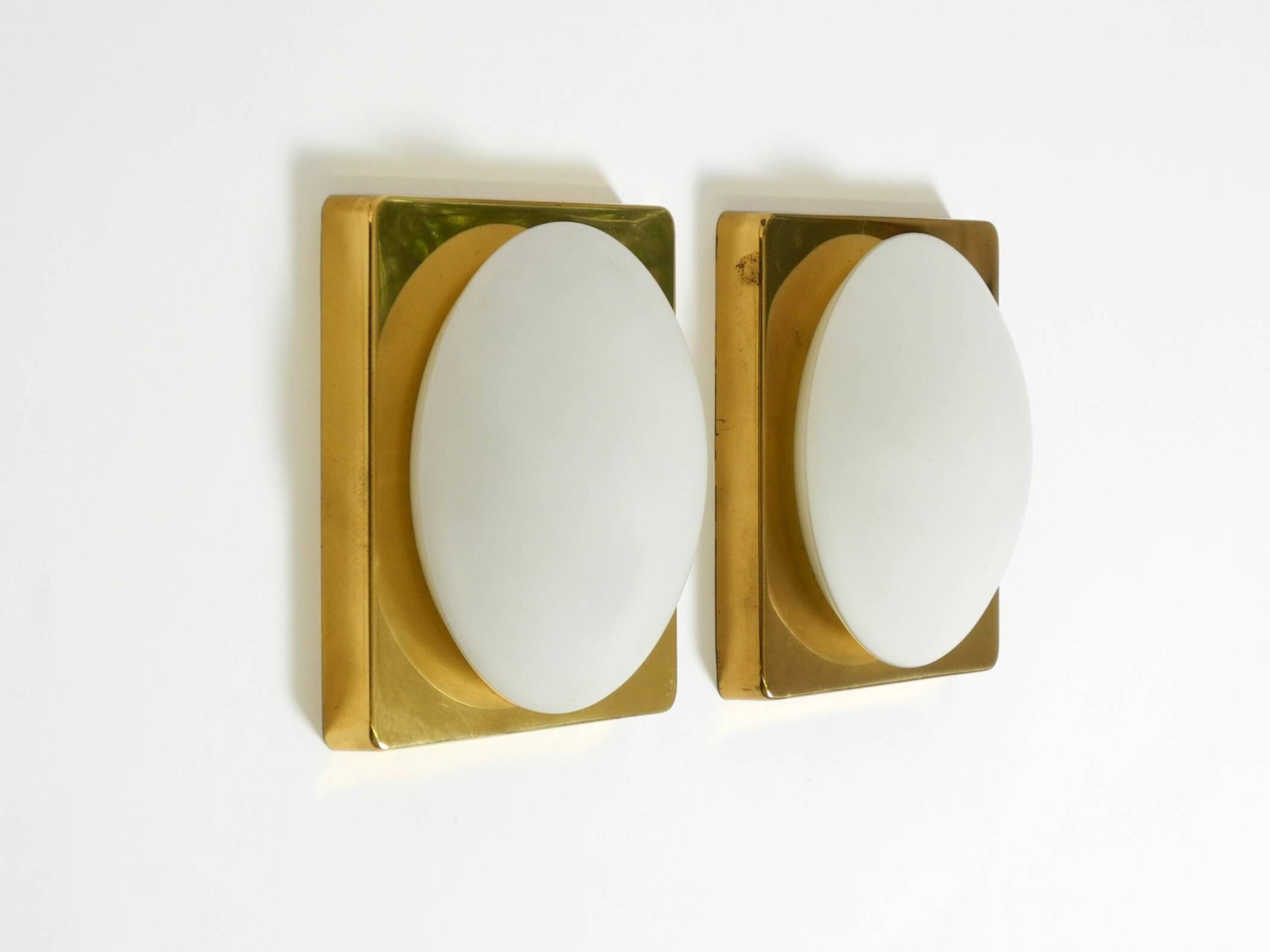 Two 1970s brass wall lamps by Rolf Krüger for Heinz Neuhaus Leuchten