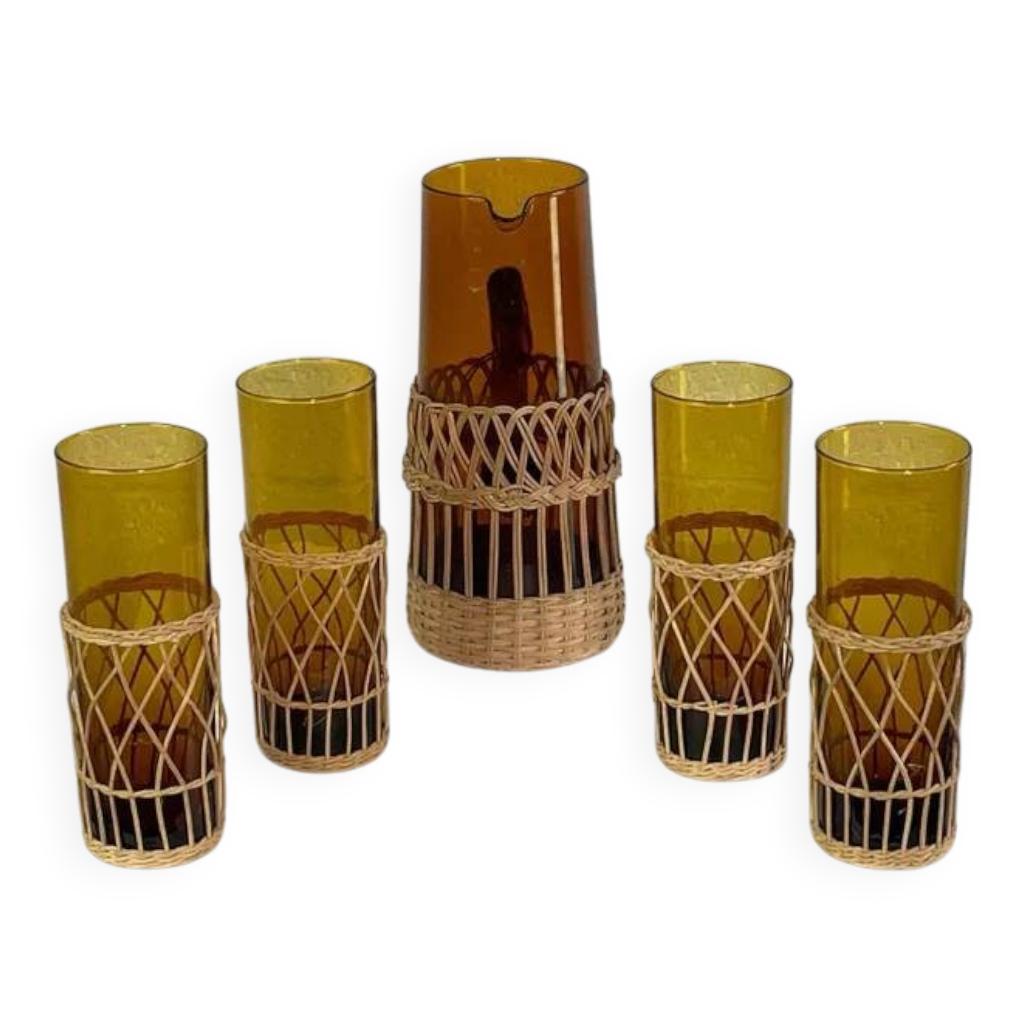 Vintage service for orangeade in amber glass and wicker.