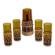 Vintage service for orangeade in amber glass and wicker.