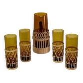 Vintage service for orangeade in amber glass and wicker.