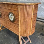 Rattan and wood bar with its decorative brass portholes