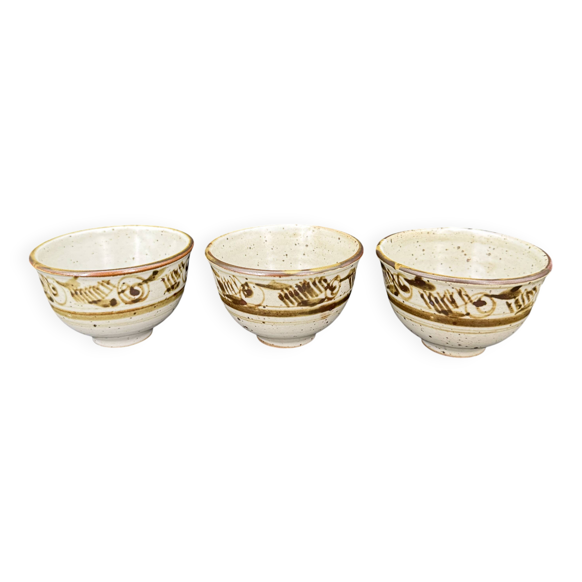 Trio of white speckled glazed stoneware bowls, gestural brown decoration – signed