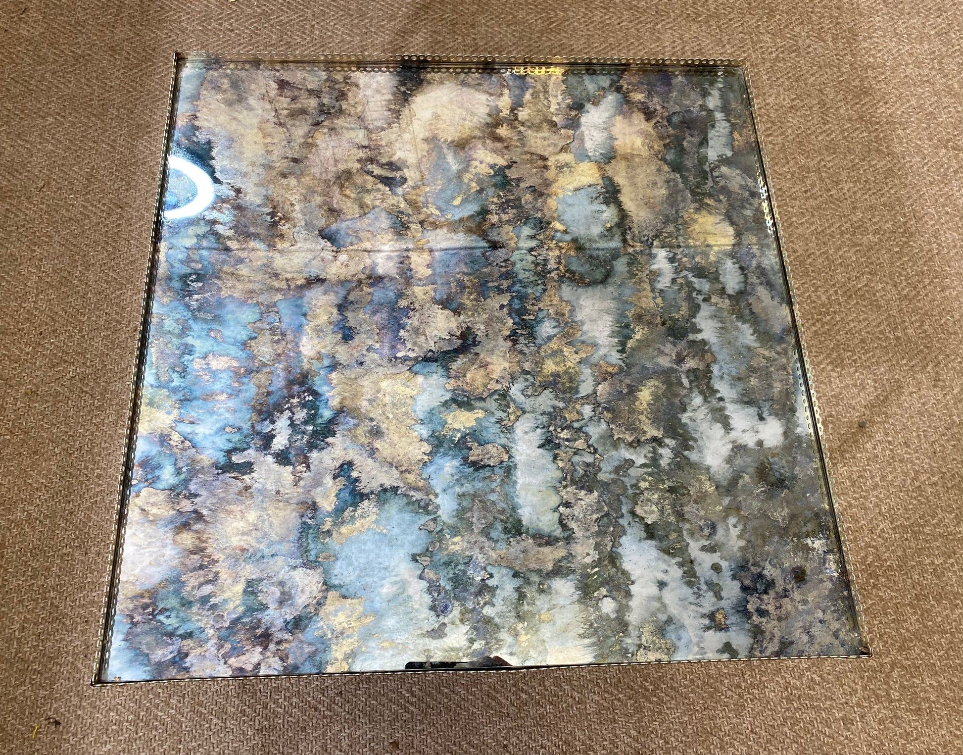 Side table with oxidised metal mirror top on a brass frame, France, 1960s.