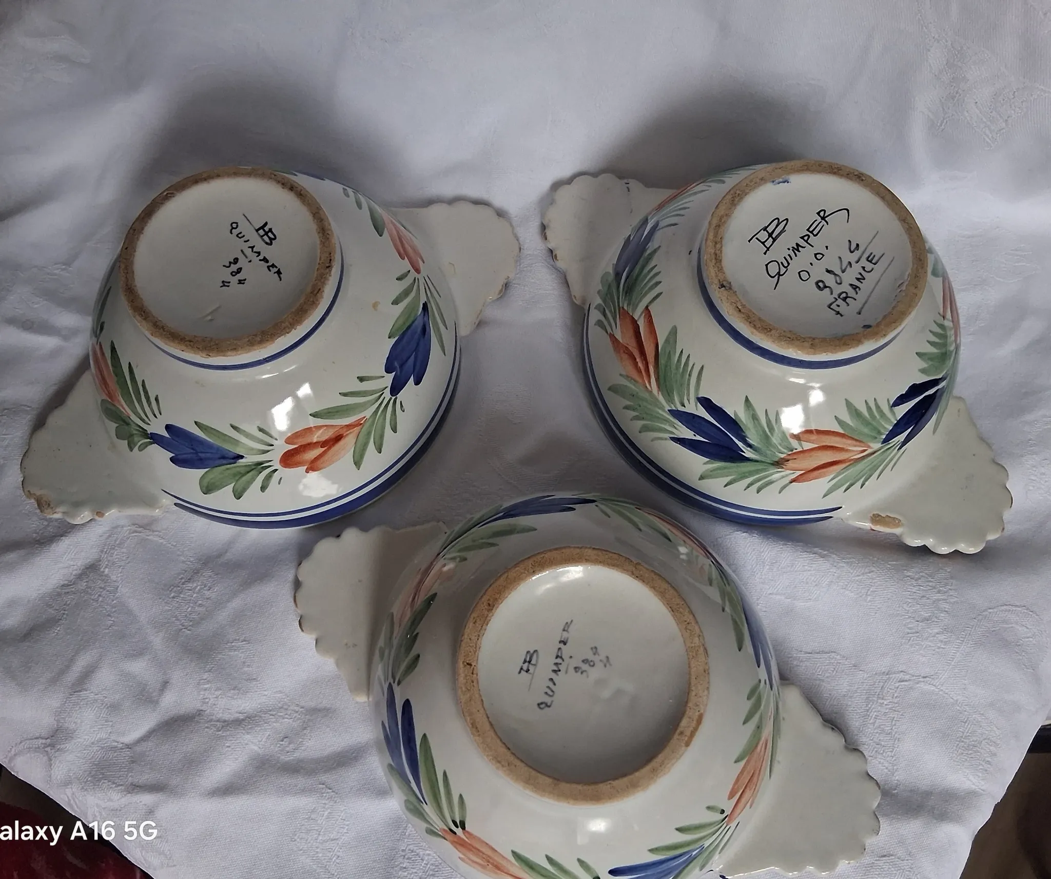 Set of three antique earthenware bowls from HB Quimper, signed.
