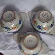 Set of three antique earthenware bowls from HB Quimper, signed.