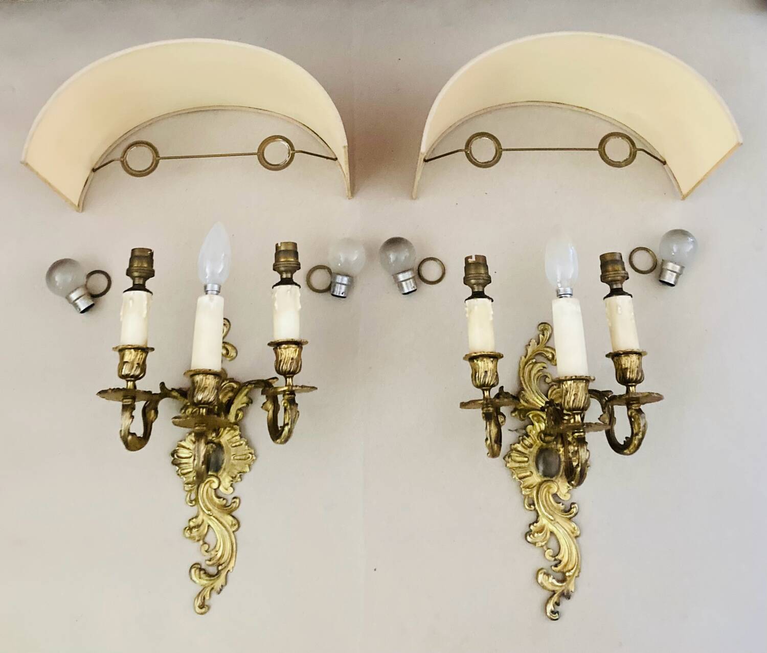 Louis XV gilt bronze wall lights from the 19th century with lampshades