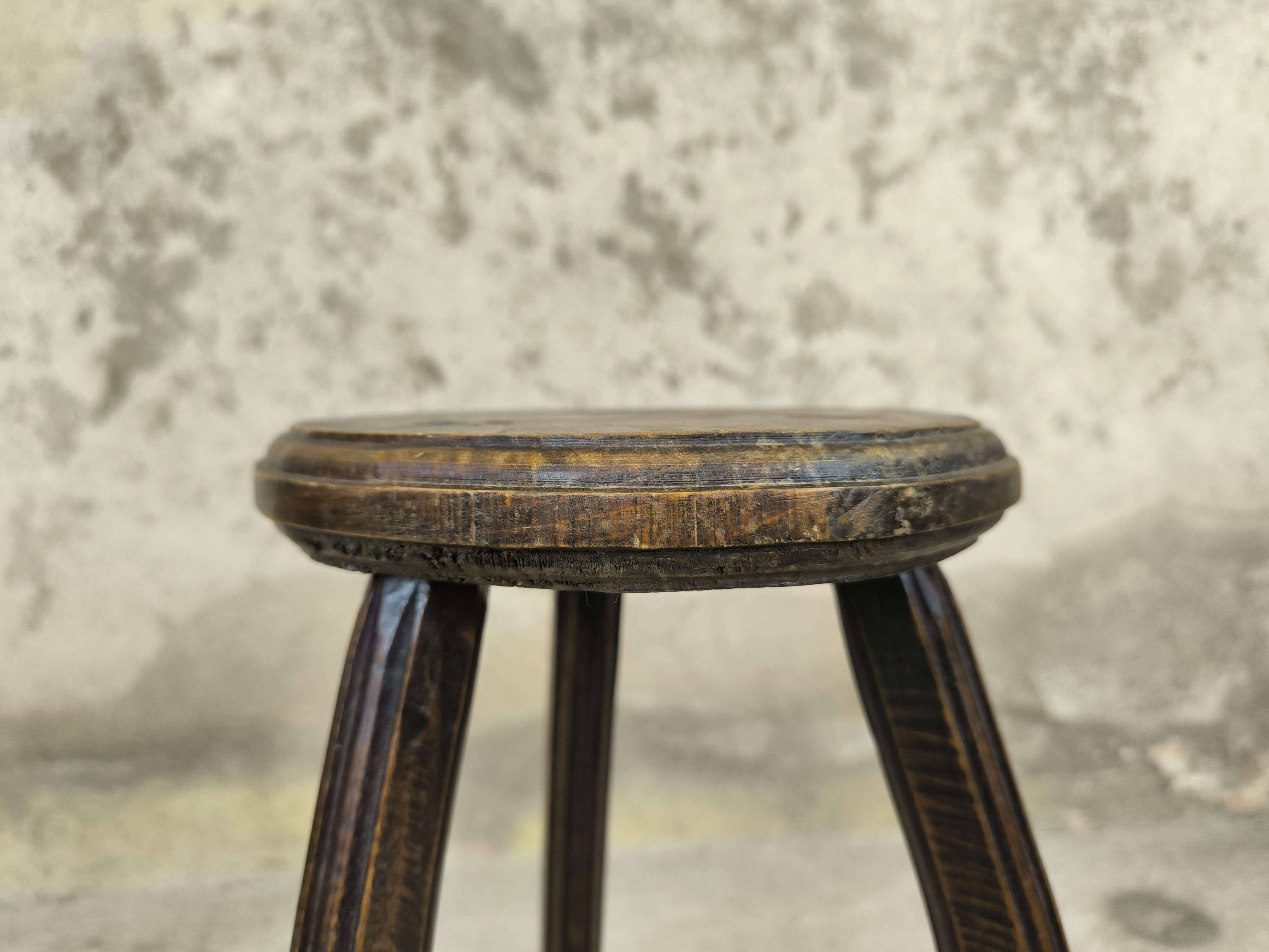 Vintage tripod plant stand with curved legs.