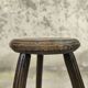 Vintage tripod plant stand with curved legs.