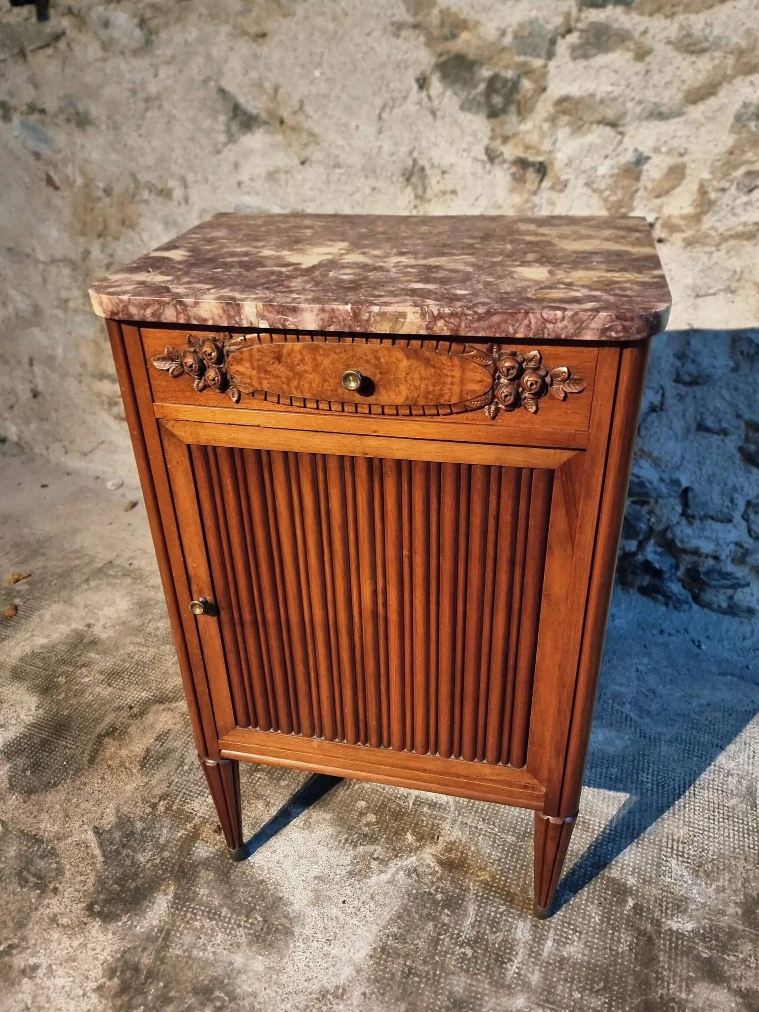 French antique bedside table in walnut with a marble top and porcelain interior, early 20th century.