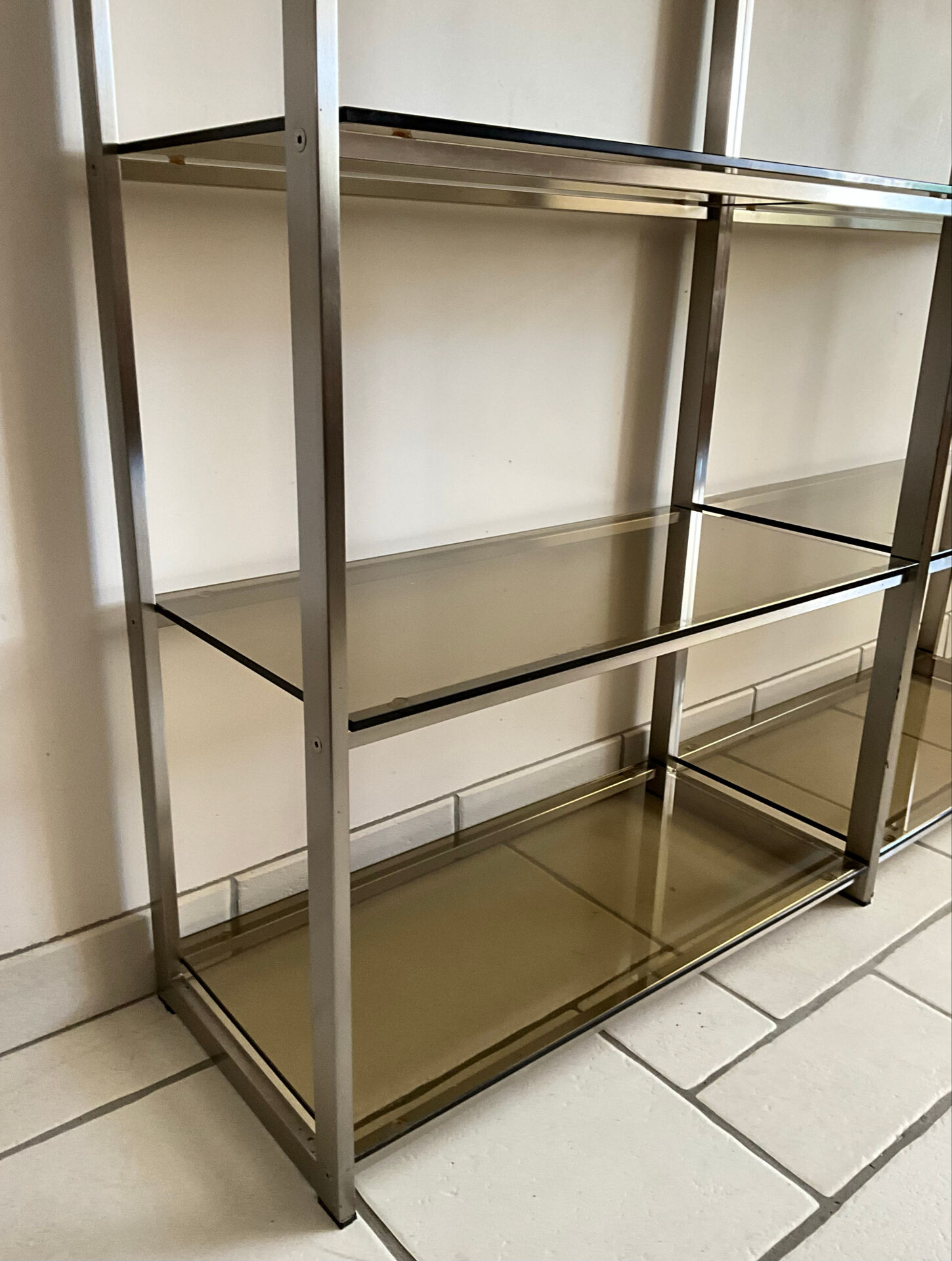 Pair of Artelano bookshelves in anodised metal and smoked glass, 1970s.