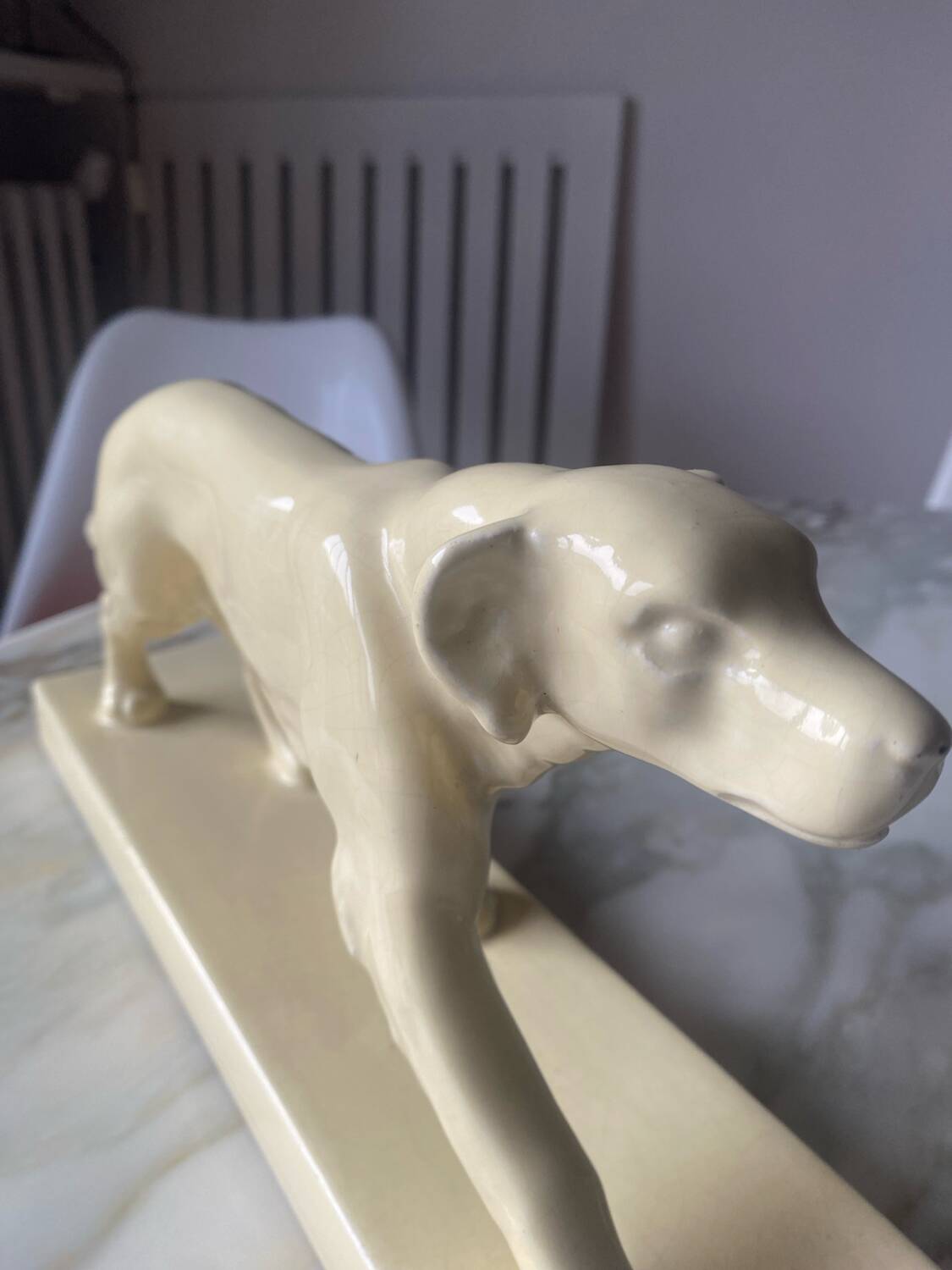 Ceramic of a walking dog brand Odyv