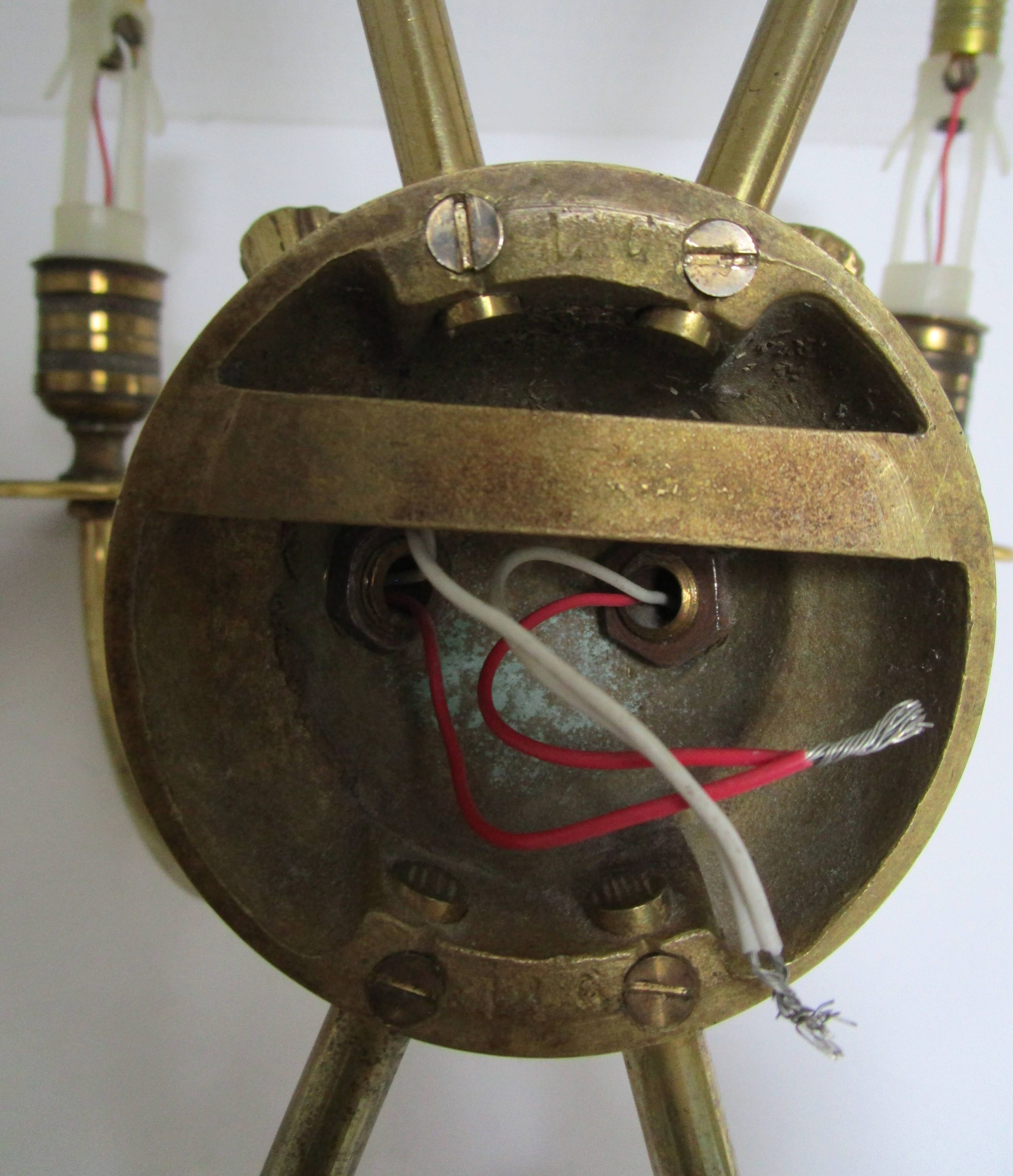 Pair of bronze crossed arrow wall lights Lucien Gau