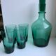 Set of a decanter and 4 design glasses in green glass 70s