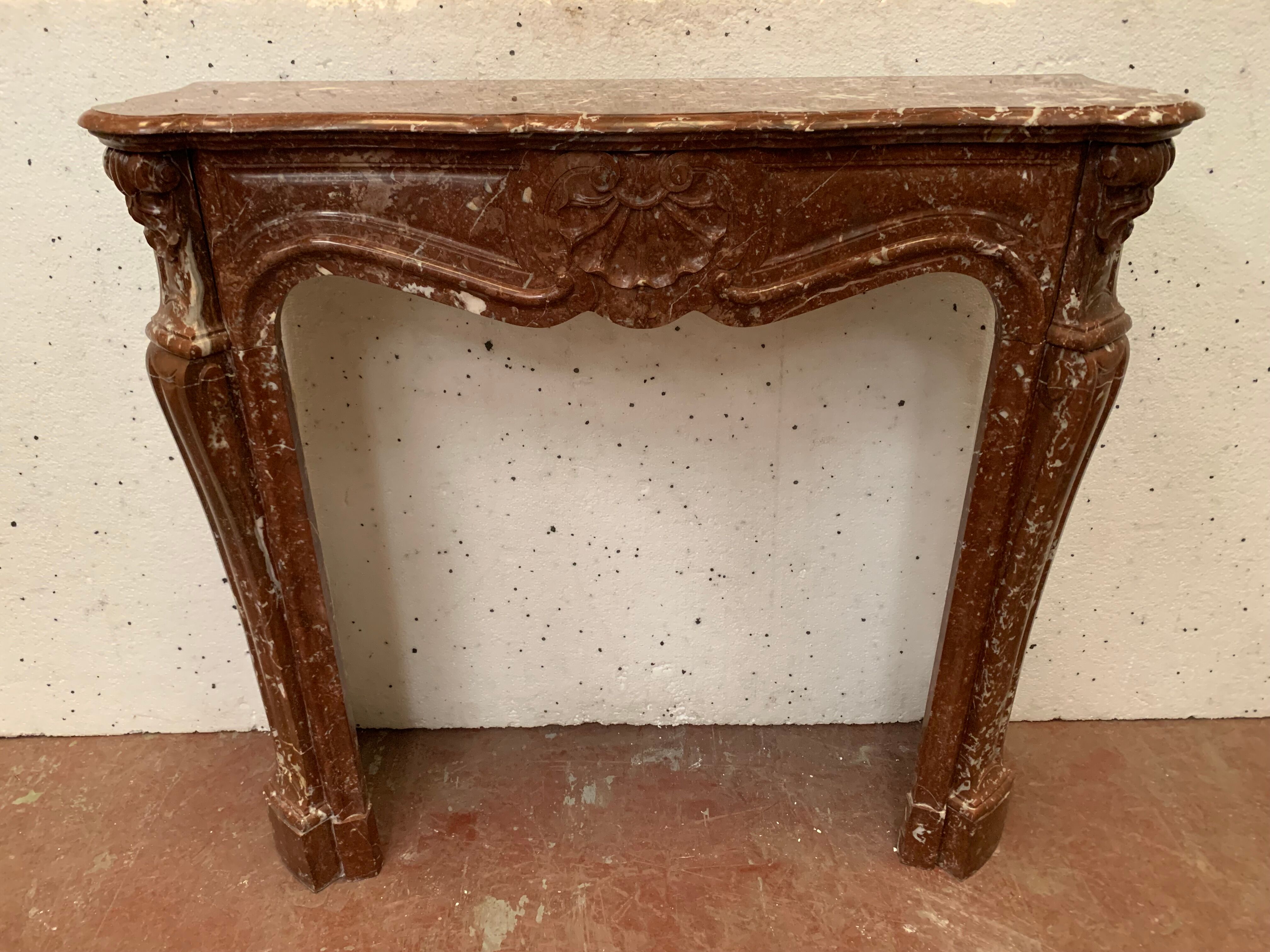 Fireplace three shells louis XV style in royal red marble XIX century