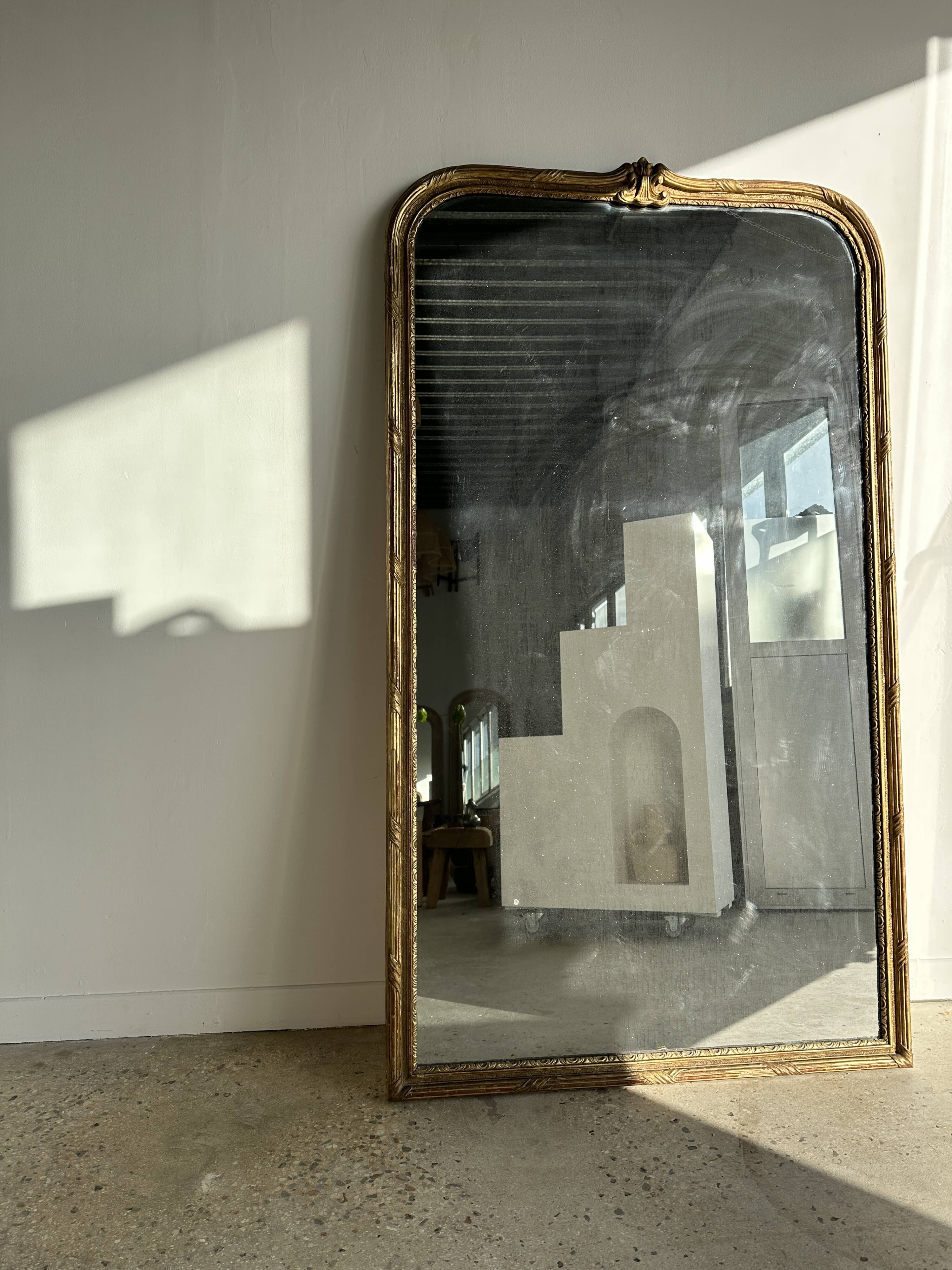 Large gilded mirror 19th century rounded corners mercury glass Louis XVI style