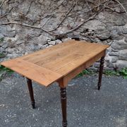 Vintage pine table with drop-leaf extension and turned beech legs, France, 1930s.