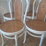 4 white rattan and cane chairs