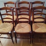 Set of 6 solid wood chairs with high-quality straw seats.