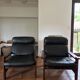 Vintage Scandinavian armchairs in leather and solid wood.