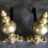 Paire de chenets en laiton et fonte, décor de marmousets, style louis xiv