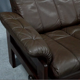 Pair of armchairs and ottoman in leather, 1970