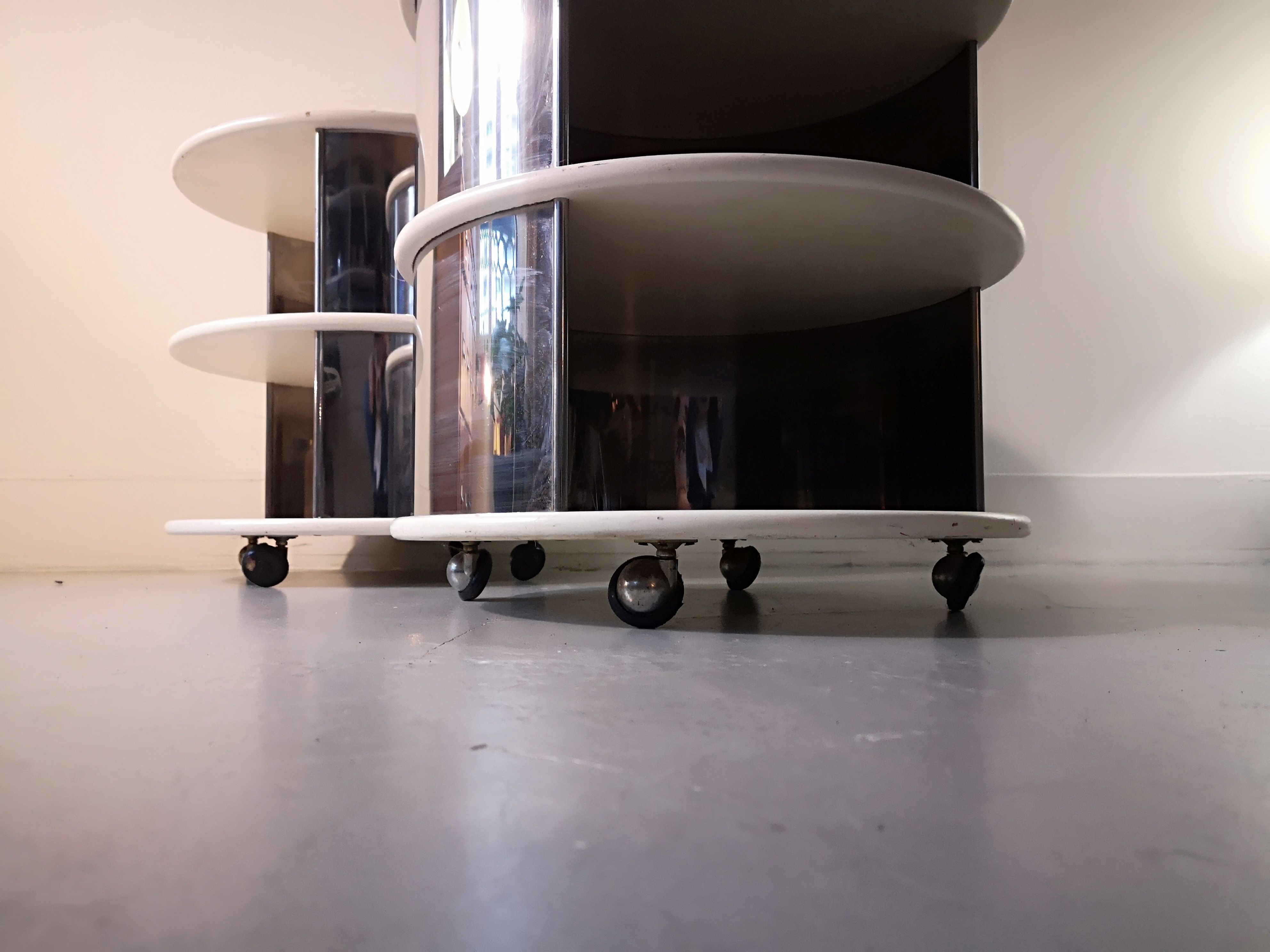 Pair of mirrored space age cylindrical bedside tables, 1960