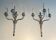 A pair of important Louis XVI style silver-plated wall sconces with three light arms.