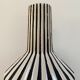 Graphic ceramic vase with black and white stripes