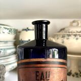 Flacon d'apothicaire eau laurier-cer. en verre bleu
