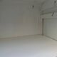 Vintage beige wardrobe made of wood and jute fabric.