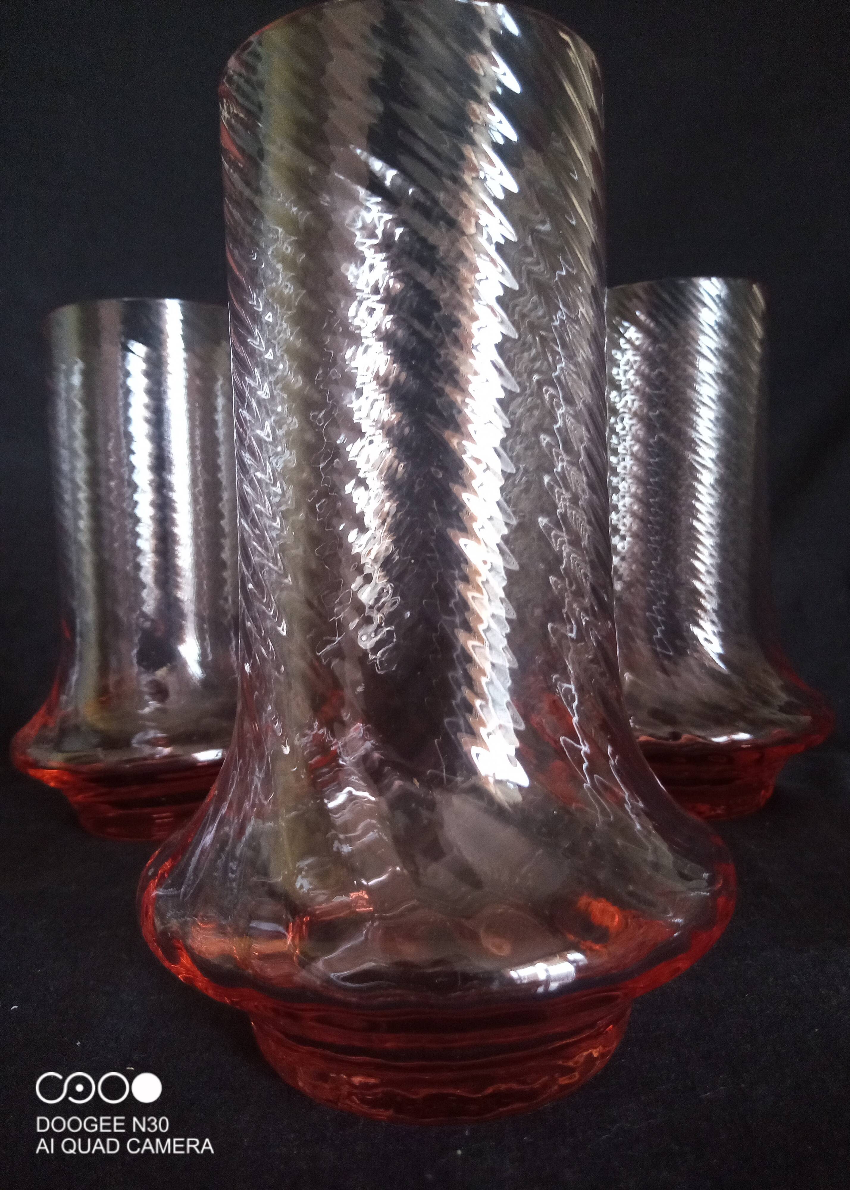 Art Deco orangeade service in pink-orange glass, twisted model.