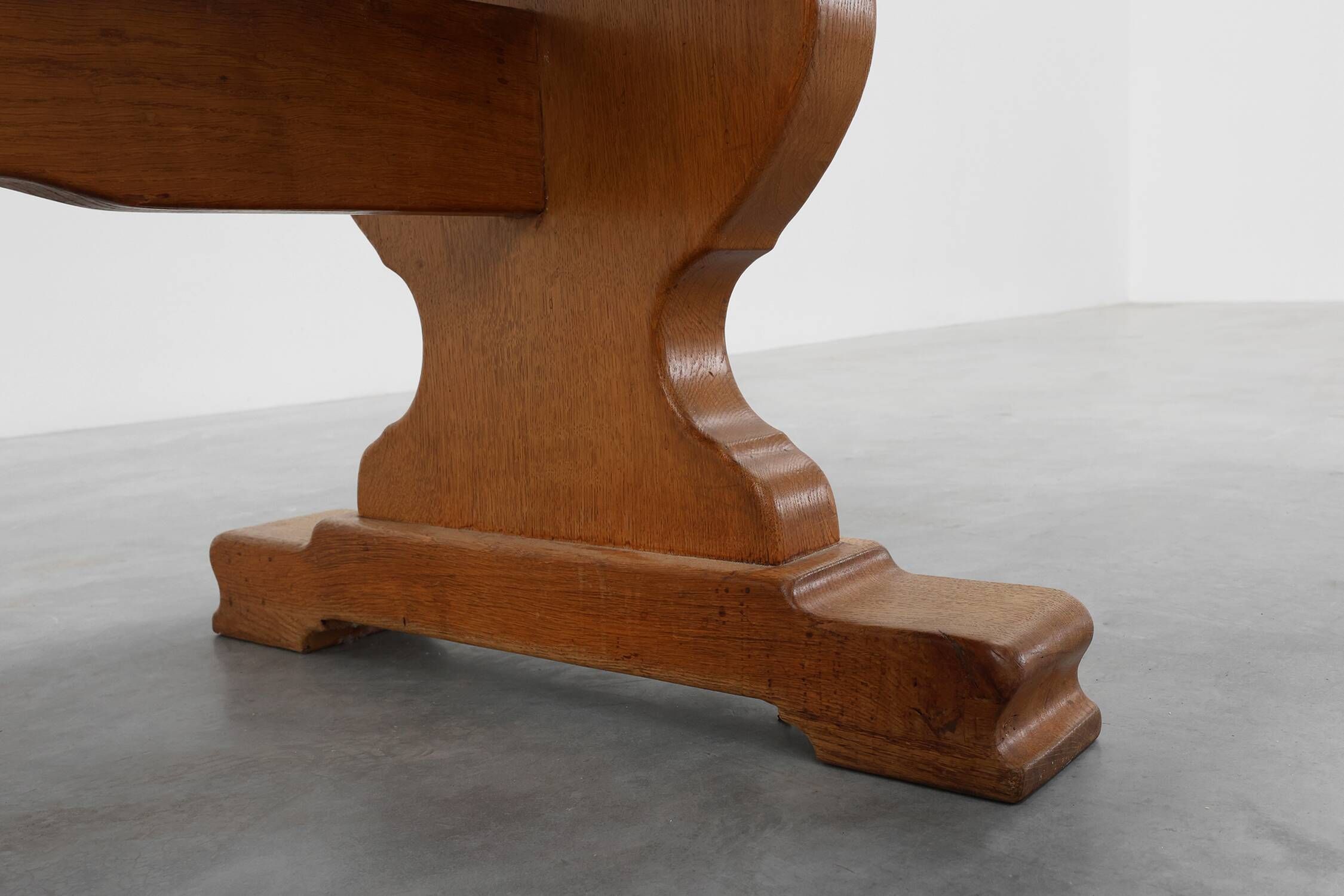 20th Century French oak trestle table with scalloped legs and plank top